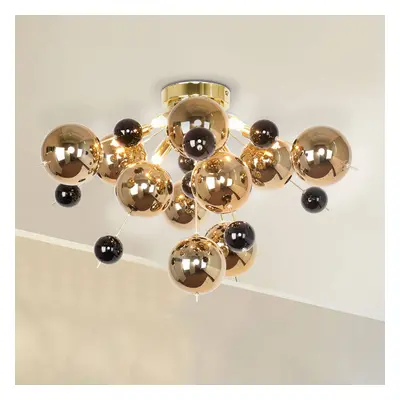 Deckenleuchte Explosion mit goldenen Kugeln